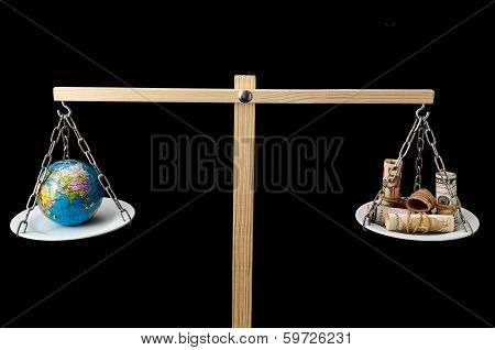 Earth and Money on a Two Pan Balance
