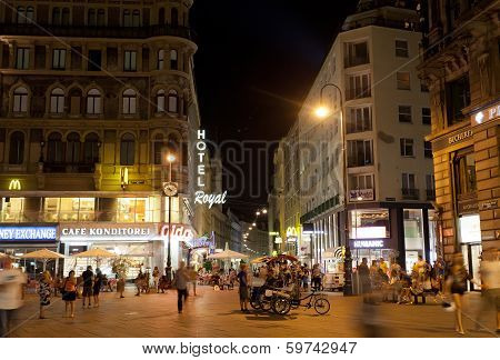 Tourists walk at night in center of Vienna