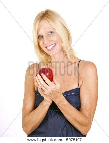 red apple blond woman