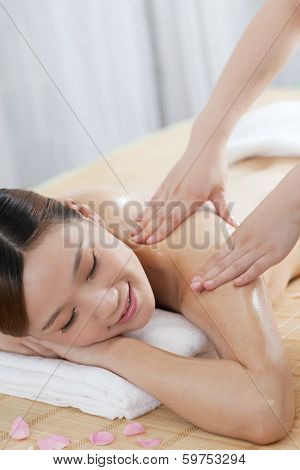 .a Young Woman Enjoying Massage.