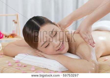 .a Young Woman Enjoying Massage.