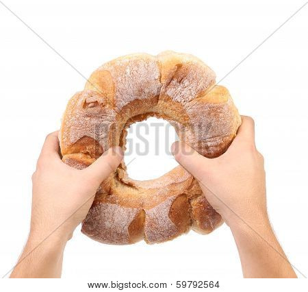 Hands hold white kalatch