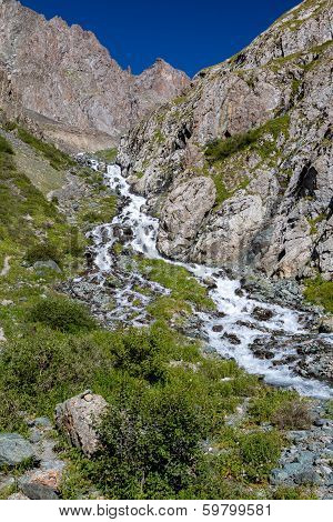 Cascade river in mountains of Tien Shan