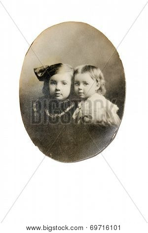 USA- CIRCA 1900s: An antique photo shows studio portrait of two children. 