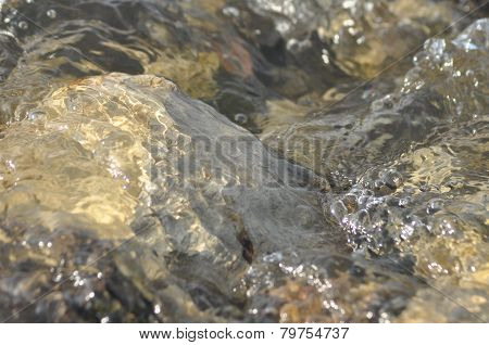 Stones In The River. Fast Flowing Water. Refreshing Mountain River Stream. The Stream Of Crystal Cle