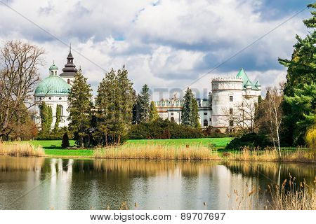 Grand Castle Near The Lake In The Park In Poland, Europe.