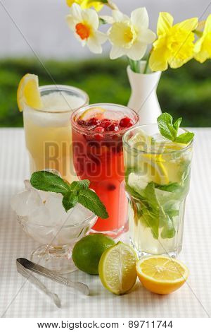 Three glasses of refreshing drink Mohito