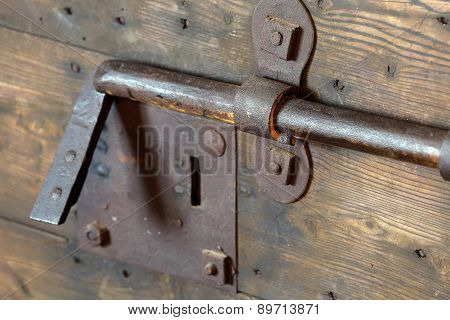 Old Lock With Big Deadbolt To Close The Door Of The Castle