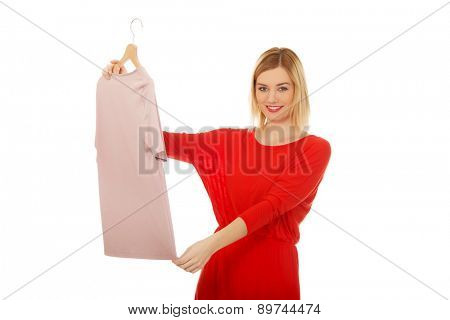 Beautiful woman thinking what to wear.