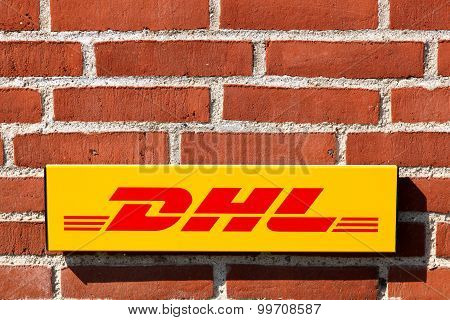 Aarhus, Denmark - August 22, 2015: DHL logo on a facade.
DHL Express is a division of the german logistics company Deutsche Post DHL providing international express mail services.