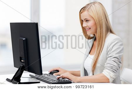picture of smiling businesswoman using her computer