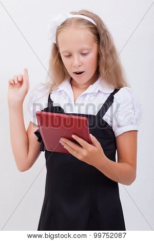 Portrait of teen girl with calculator on white background