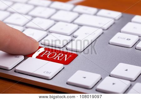 Finger Pressing On Red Button With Porn Word And Naked Woman Silhuette On It