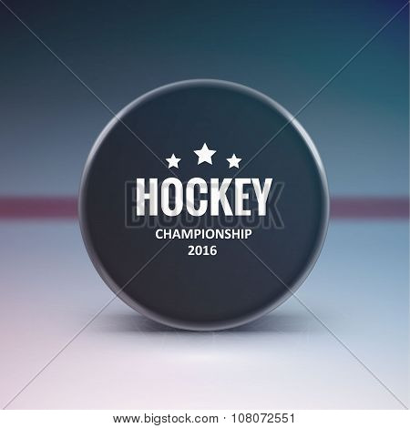 Hockey puck isolated on ice with blur