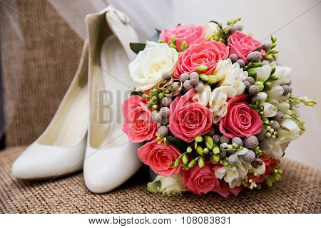 wedding shoes rings and bouquet