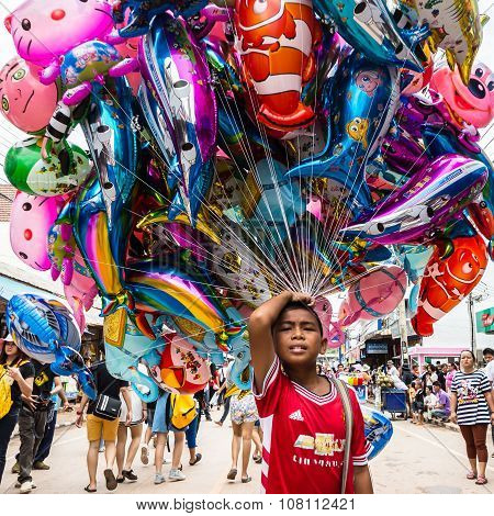 Thailand June 27: Boy sell cartoon balloon in Phitakhon festival on june 27 2015 in loei province of thailand