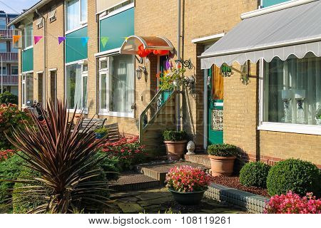 Picturesque Residential House With Decorative Plants Before It In Small Dutch Town Zwanenburg, The N