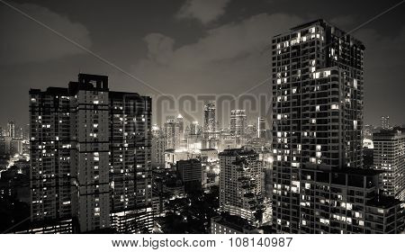 Cityscape night scene of capital city center. Condominiums, towers, and business building exterior architecture concept