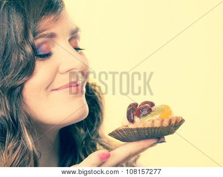 Woman Closed Eyes Holds Cake In Hand