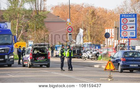 STRASBOURG FRANCE - NOV 14 2015: French Police checking vehicles on the 'Bridge of Europe' between Strasbourg and Kehl Germany as a security measure in the wake of attacks in Paris