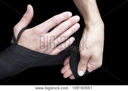 Kickboxer or muay thai fighter equips and trains outdoor.