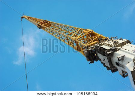 yellow crane on blue sky