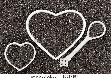 Chia seed health food in heart shaped porcelain bowls and spoon forming an abstract background.