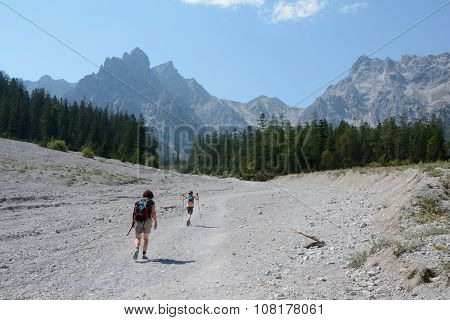 Woman And Kid Walking On Talus In Wimbachtal Valley.