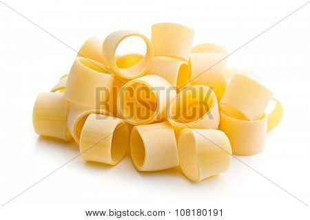 uncooked pasta calamarata on white background