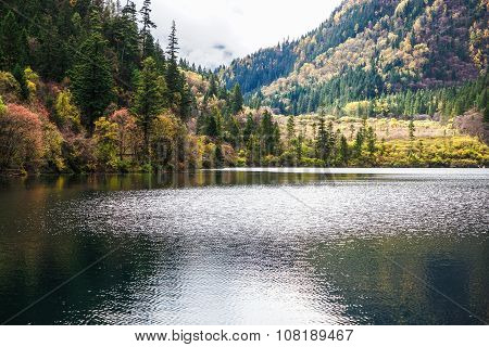 Scenery Of Lake in Forest with Colorful Leafs and Mountain in Autumn