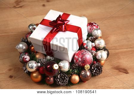 New Year gift on a golden tinsel background boly