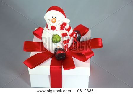 New Year gift on a golden tinsel background boly