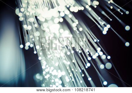 Fiber optic cables, fibre connection, telecomunications concept.