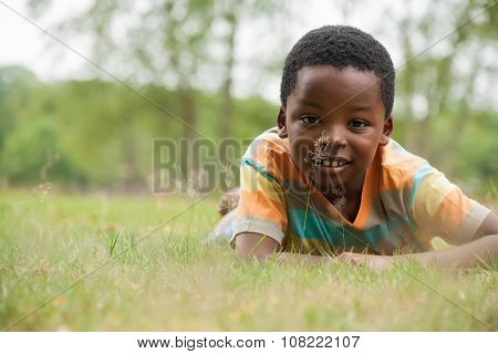 African Boy In The Grass
