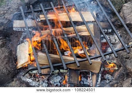Empty Barbecue Grill With Bright Flames Closeup