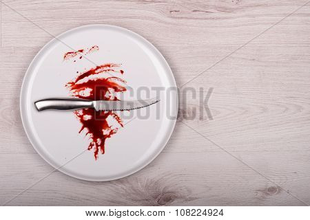 Knife On White Plate With Blood, Wooden Background