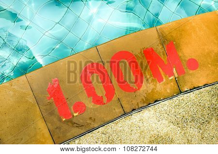 Swimming pool with Number 1.00 on ground at hotel