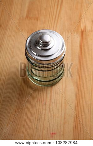 air tight glass jar on the wooden background