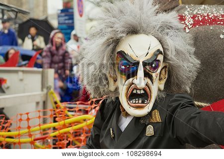 Person wears carnival mask at Basel Carnival in Basel, Switzerland.