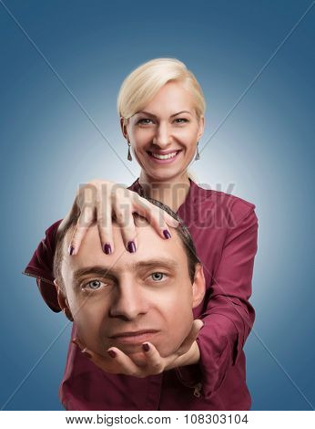 Happy analyst with client's head in her hand