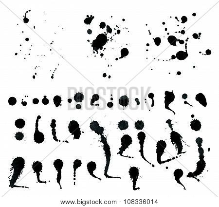 Black ink spray drops isolated on white background.