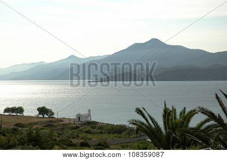 A small white church on the Aegean coast in the morning