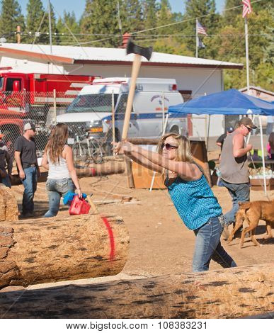West Point, CA - October 4, 2014 Axe throwing & Chainsaw log cutting competitions at the Lumberjack Day Parade event