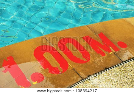 Swimming pool with Number 1.00 on ground at hotel