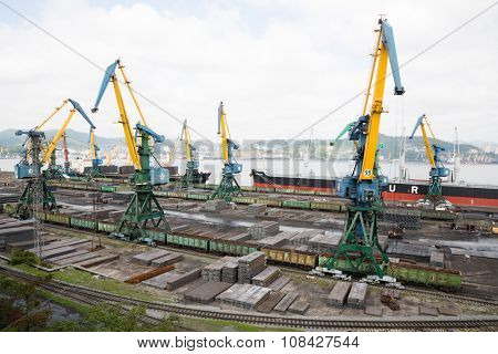 NAKHODKA, RUSSIA - CIRCA SEPTEMBER, 2015: Loading metal in cargo ships at the port of Nakhodka. It is the largest port in Russia, main export goods in port of Nakhodka are coal, oil, wood and metals