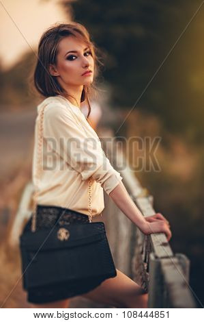 Beautiful young woman  with makeup in fashion clothes