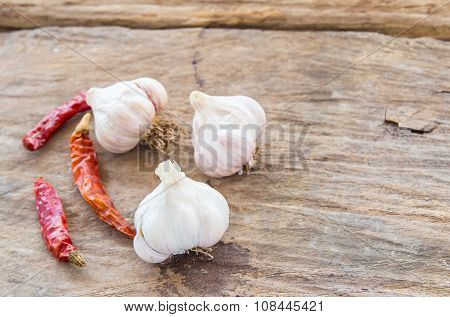 Garlic And Dry Chili On Wooden Background