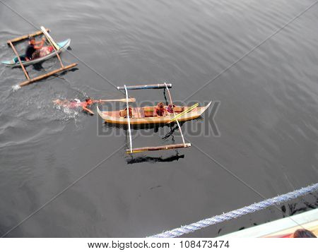 Boys in an Outrigger Canoe