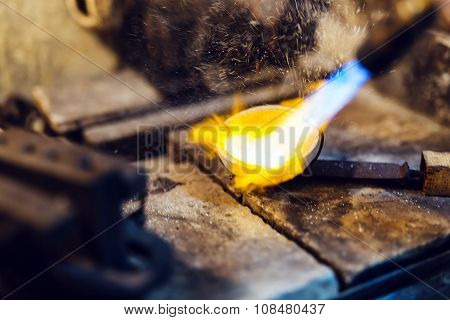 Jeweler Melting Gold