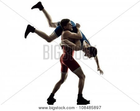 two caucasian wrestlers wrestling men on isolated silhouette white background